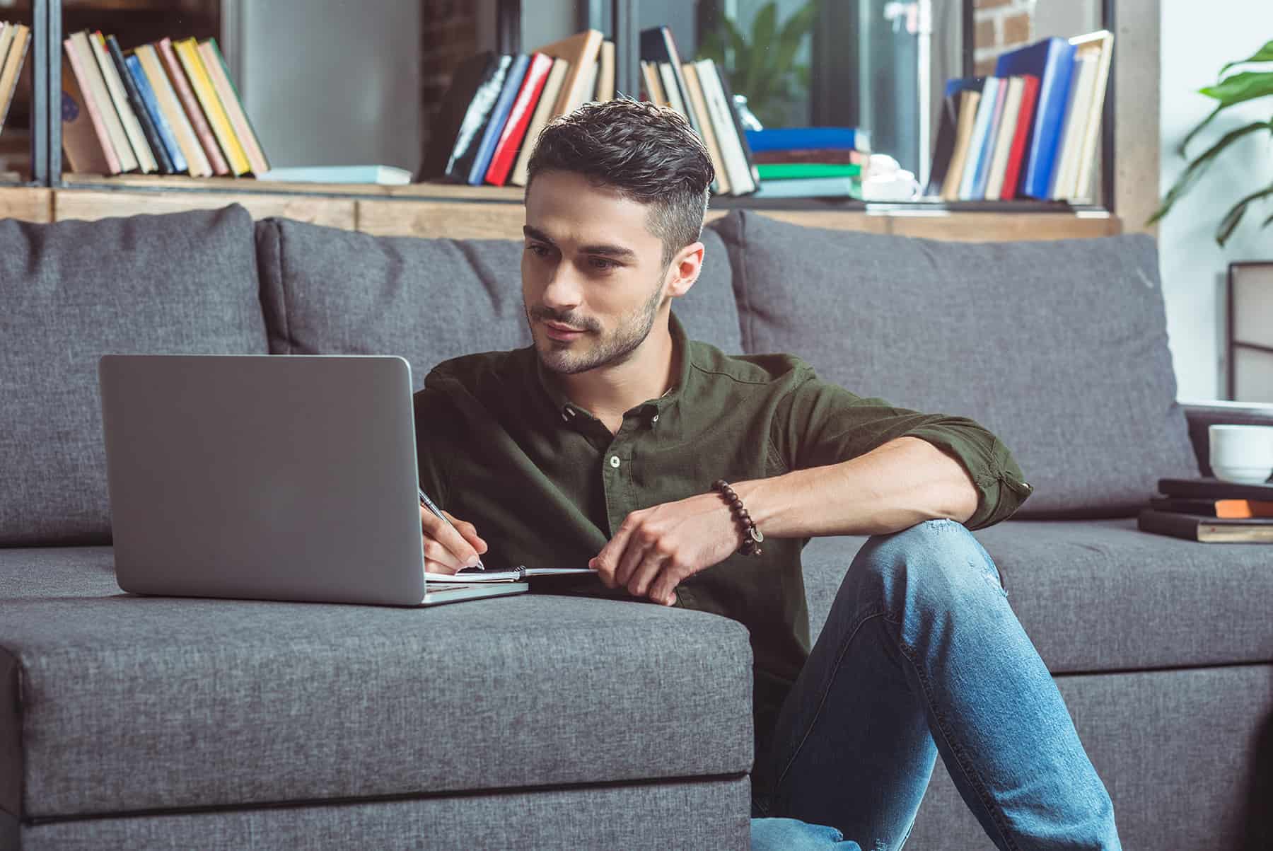 Man searching for Health Coach jobs online