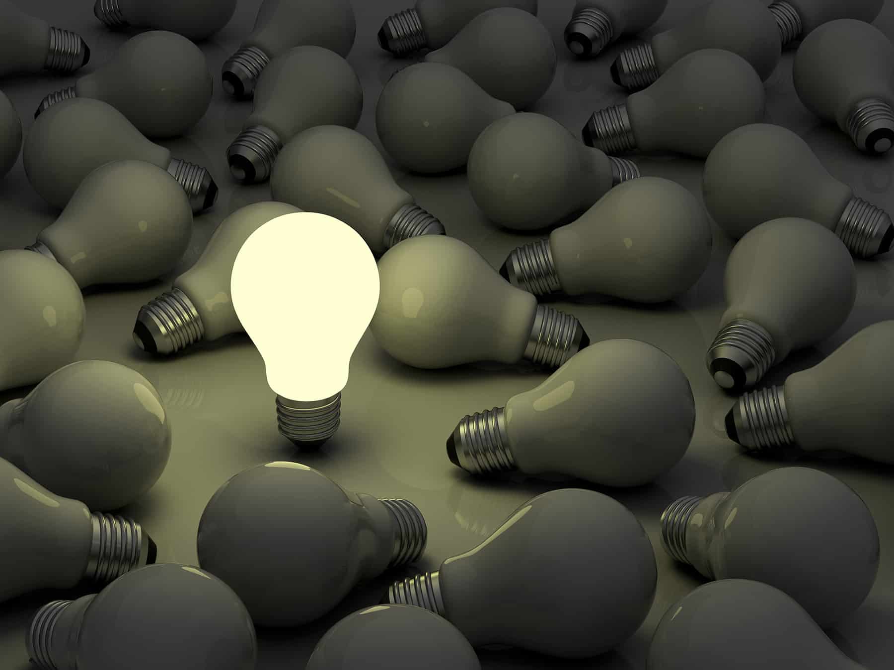 Bright light bulb standing out
